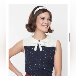 Sleeveless Navy Polka Dot Bow-Accent Blouse with White Yoke